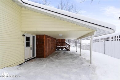 Carport with storage sheds