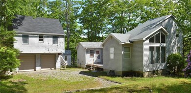 Side yard view of the house & 2 car...