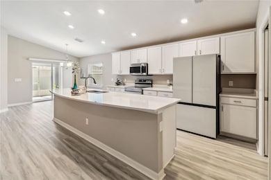 Central kitchen island with Stainless steel appliances