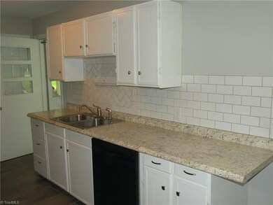 Kitchen Features New Tile and Countertops