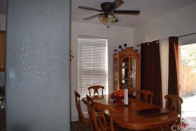 Dining Room has sliding glass doors out to the cov