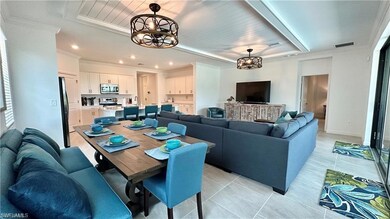Tiled dining area with a notable chandelier, crown