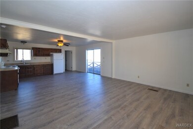 Unfurnished living room featuring hardwood / wood-