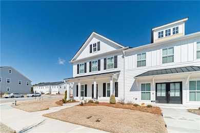 View of front of property with french doors, cover