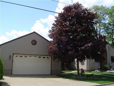 Exterior Front. Great attached garage cement drive