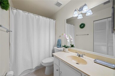 Bathroom featuring tile floors, large vanity, and 