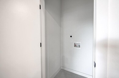 Washroom with electric dryer hookup, washer hooku