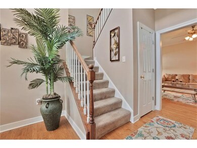 Two story foyer looking into family room