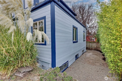 Behind the building.