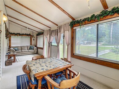 enclosed front porch with so much natural light.