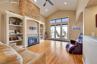 Living area featuring visible vents, light hardwoo