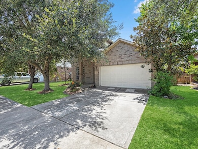 This is a single-story brick home with a two-car g