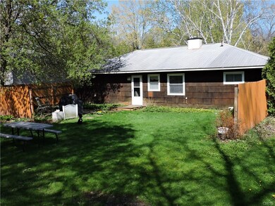 Level partially fenced in backyard. Just enough sp