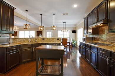 Lovely kitchen with lots of cabinets, granite and hardwoods!