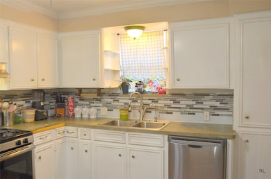 Kitchen with Gas Range & Dishwasher.