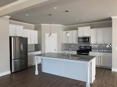 Kitchen with a sink, decorative backsplash, stainl