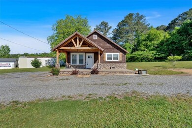 View of front of home with covered porch and a fro