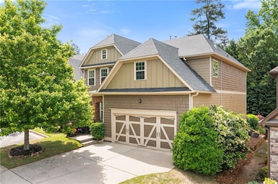 Craftsman inspired home with roof with shingles, a