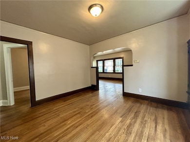 Spare room featuring hardwood / wood-style flooring