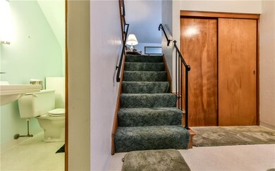 The lower level has a convenient powder room acros