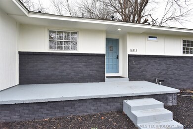 A closer look at the home's entry.  Ample porch sp