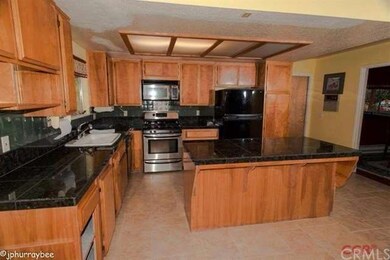 Large kitchen with breakfast bar.