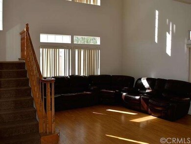 Living room with stairs to to 2nd level.