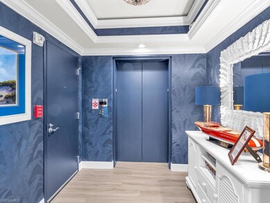 Misc room featuring wallpapered walls, wood finish