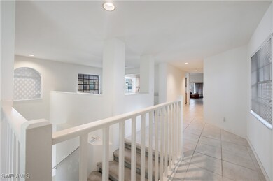 Hall featuring light tile patterned flooring