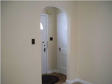 Foyer with coat closet.