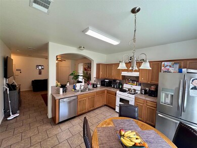 Kitchen featuring stainless steel appliances, a s