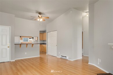 View from living room toward the kitchen eating bar, and hallway to bedrooms on the right. See sold listing      MLS# 1567210 for remodel and furnishing ideas.
