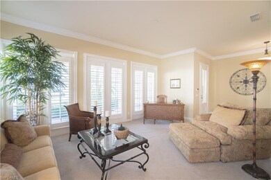 Sun filled Living Room overlooks the lush landscap