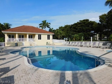 Community pool with a patio