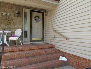 Exterior Front. Sheltered front porch protects you from the weather & offers a pleasant spot to sit & relax, too.