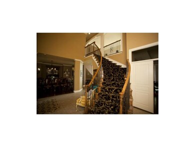 Curved staircase to upper level bedrooms