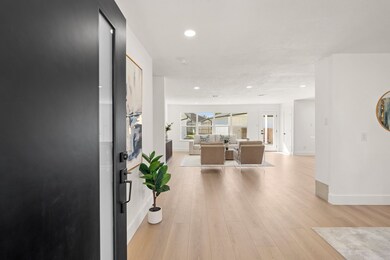 Enter the light filled home and your eyes immediately register the light, bright, and airyness of this completely renovated home.