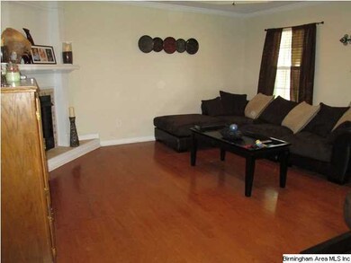 Step into this charming living room with hardwood 
