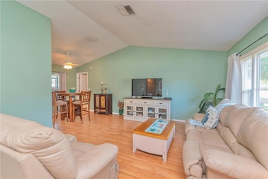 Living room with cathedral ceilings.