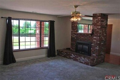 Wood floor in the kitchen leads to adjacent dining