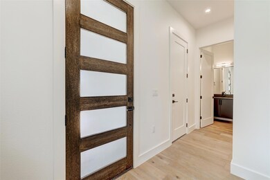 Hallway featuring light wood-type flooring, reces