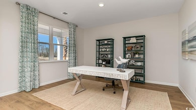 Office area featuring wood finished floors, baseboards, and recessed lighting