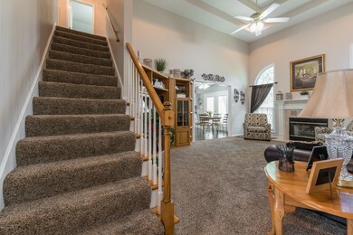 Great Room is the heartbeat of the home with a two-story, double tray ceiling and ceiling fan, with a
focal point gas fireplace