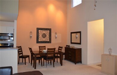 Dining Room with cathedral ceiling.