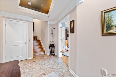 Spacious Foyer with ornamental molding, a trey cei