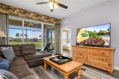 Living area with light wood-style flooring, visibl