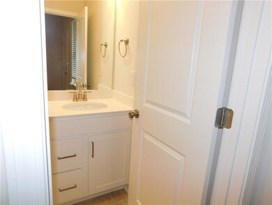 Bathroom featuring vanity and light tile patterned floors