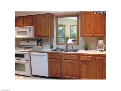 One view of the kitchen with a pass through to the