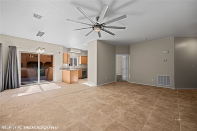 Unfurnished living room with baseboards, visible v