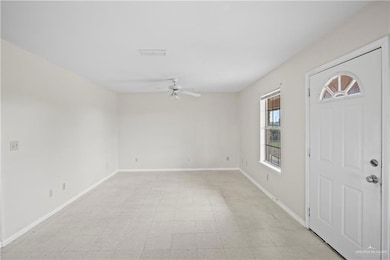 Entryway featuring ceiling fan and light floors